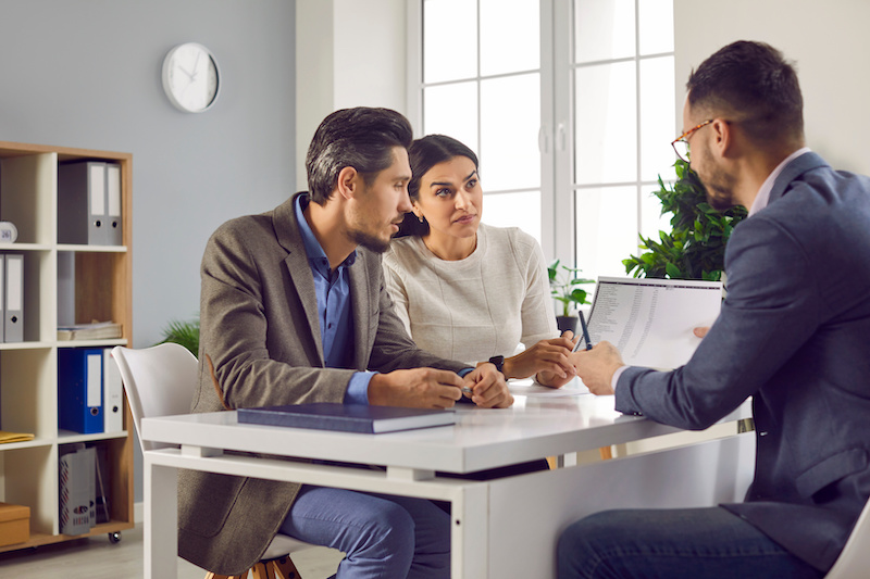 Family couple talking to a investors buyers agent